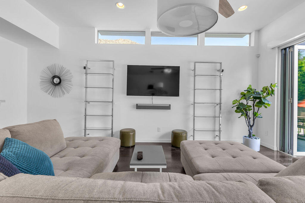 350 Goleta Way Palm Springs, CA 92264 - Photo 8 of 60 a living room with furniture and a flat screen tv