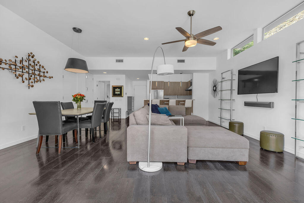 350 Goleta Way Palm Springs, CA 92264 - Photo 10 of 60 a living room with furniture a flat screen tv and kitchen view