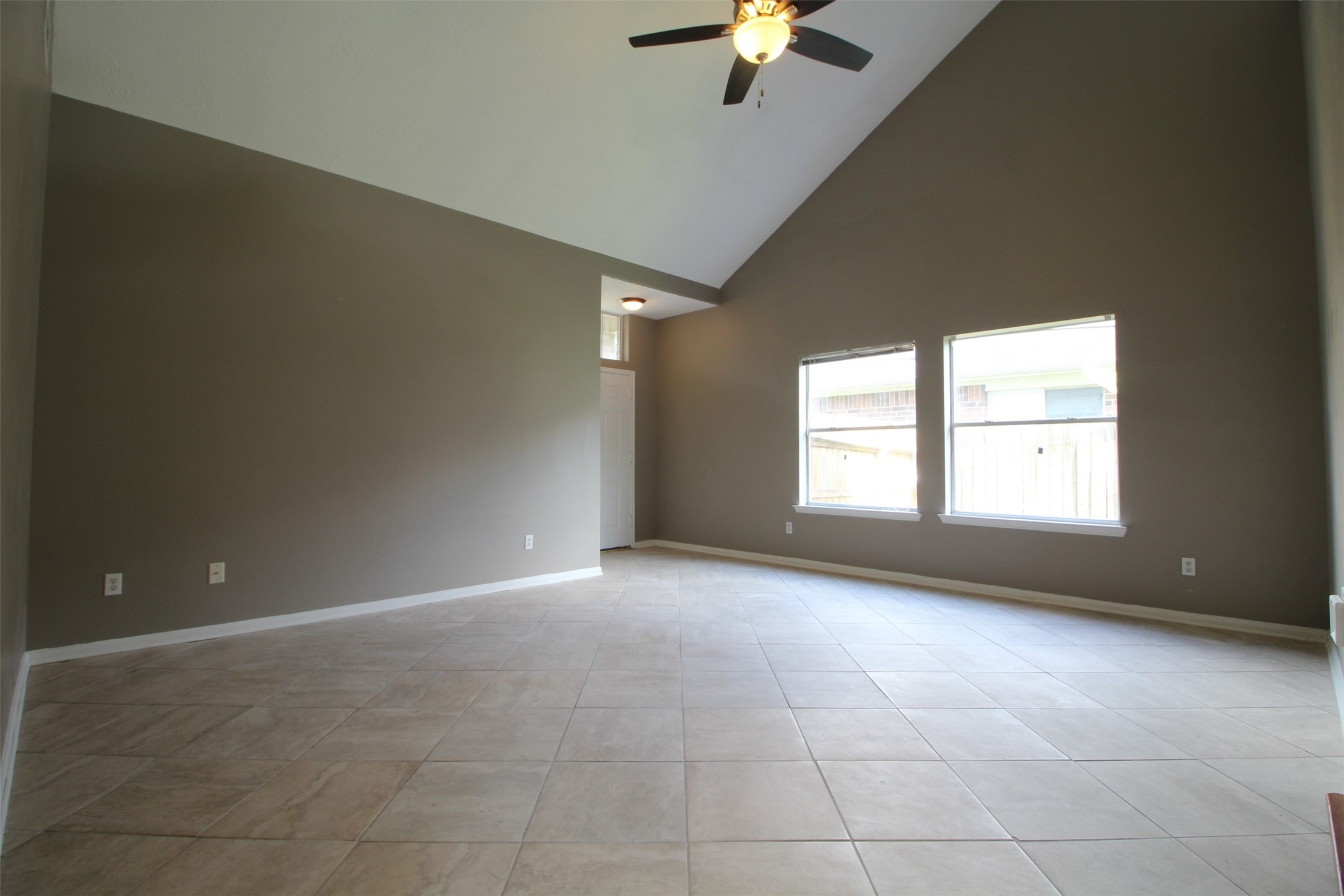 6803 Highwind Bend Lane Katy, TX 77449 - Photo 3 of 10 a view of an empty room with a window