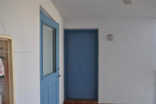 a view of a hallway with closet