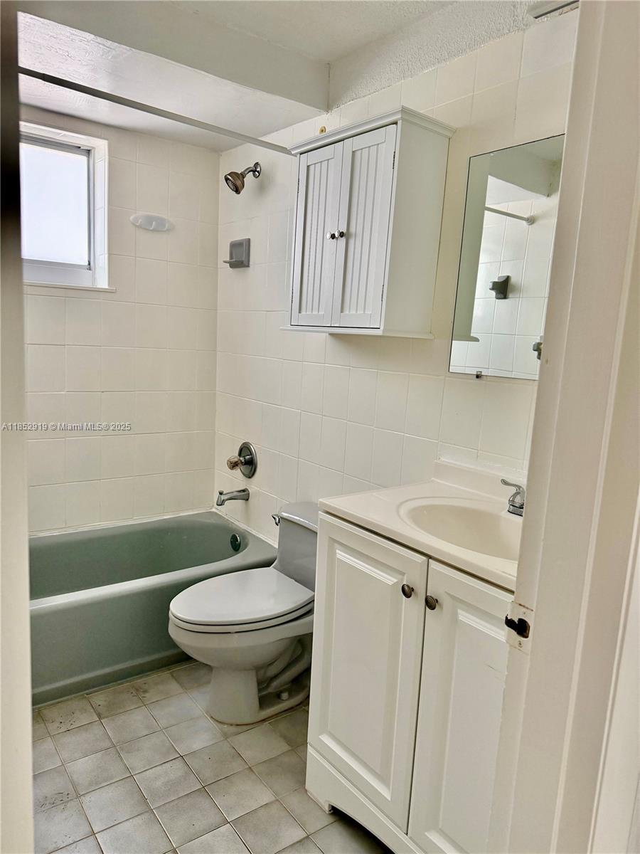 251 Galen Drive, Unit 204E Key Biscayne, FL 33149 - Photo 10 of 16 a bathroom with a sink a toilet and shower