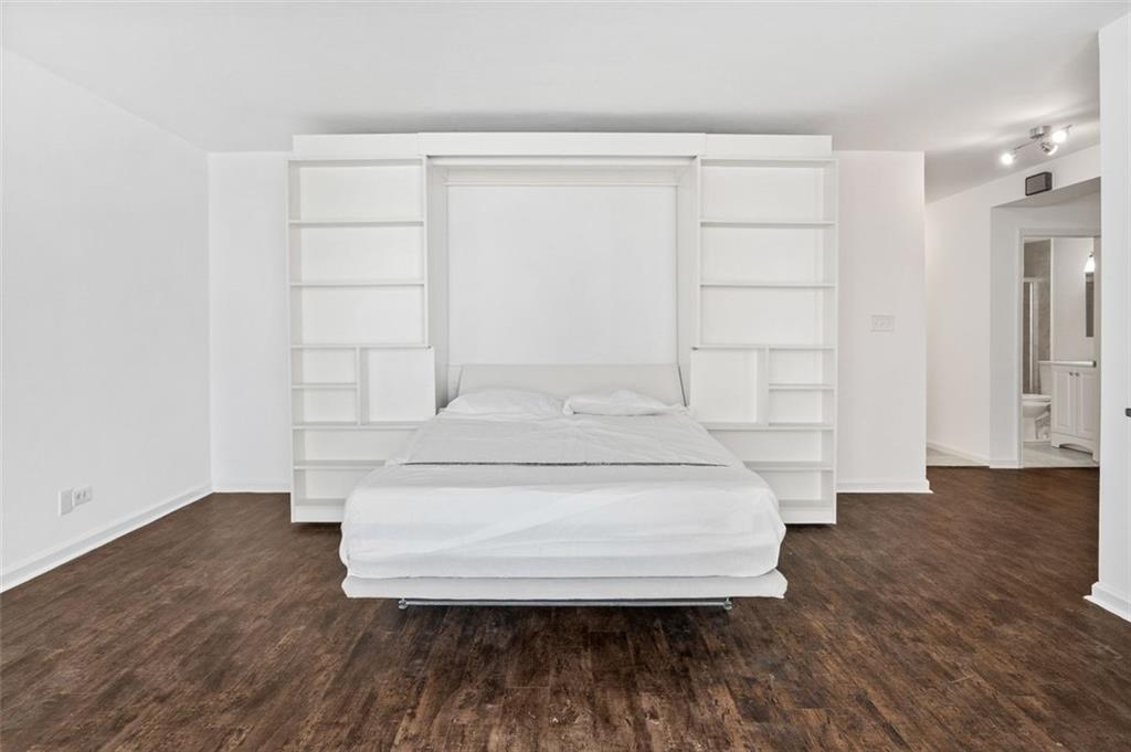 620 Peachtree Street Northeast, Unit 1716 Atlanta, GA 30308 - Photo 12 of 37 a view of washer and dryer with wooden floor