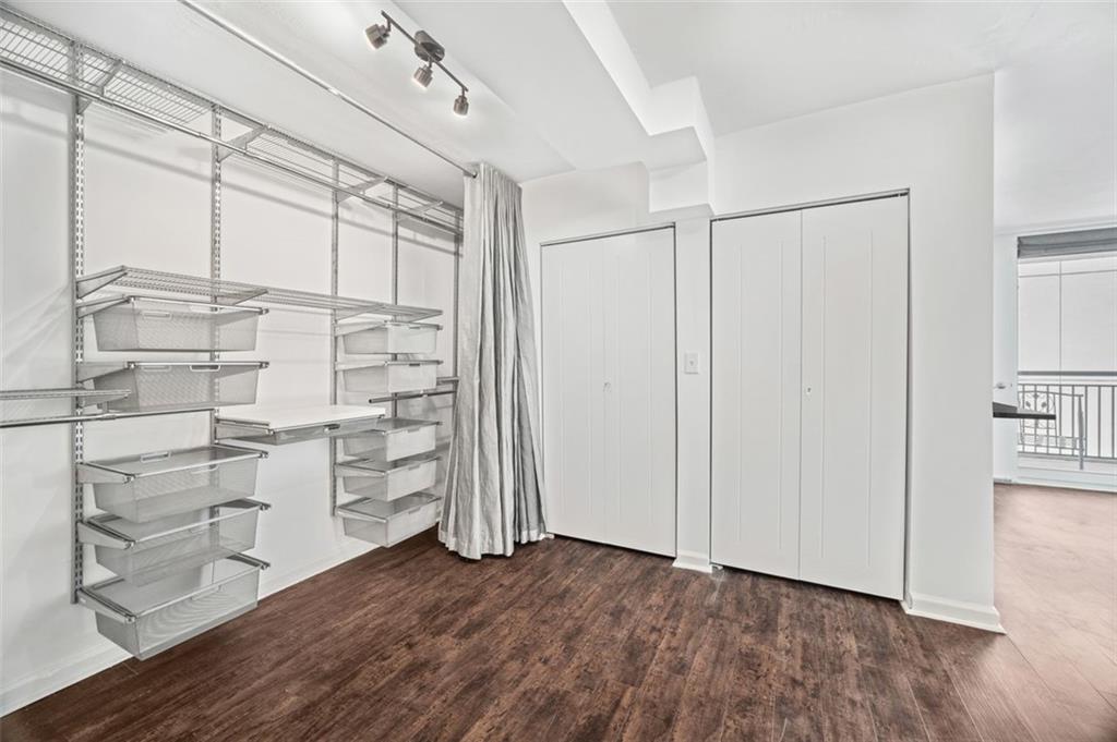620 Peachtree Street Northeast, Unit 1716 Atlanta, GA 30308 - Photo 14 of 37 a view of walk in closet with empty racks