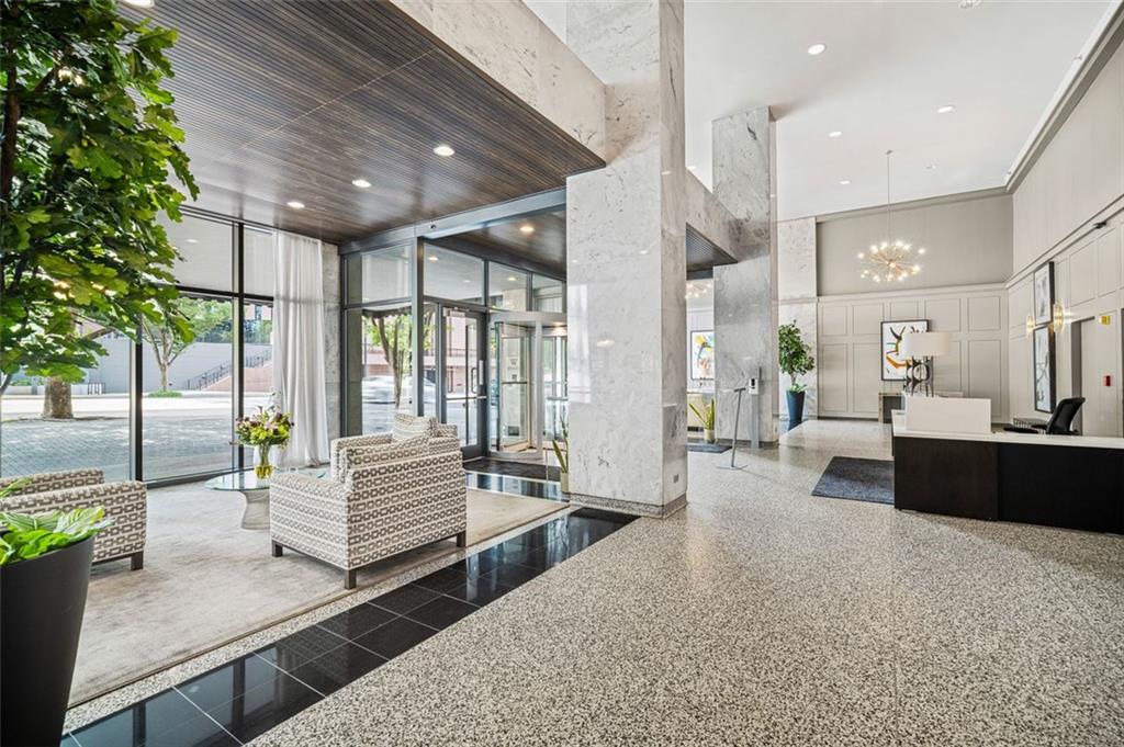 620 Peachtree Street Northeast, Unit 1716 Atlanta, GA 30308 - Photo 21 of 37 a living room with furniture and a potted plant