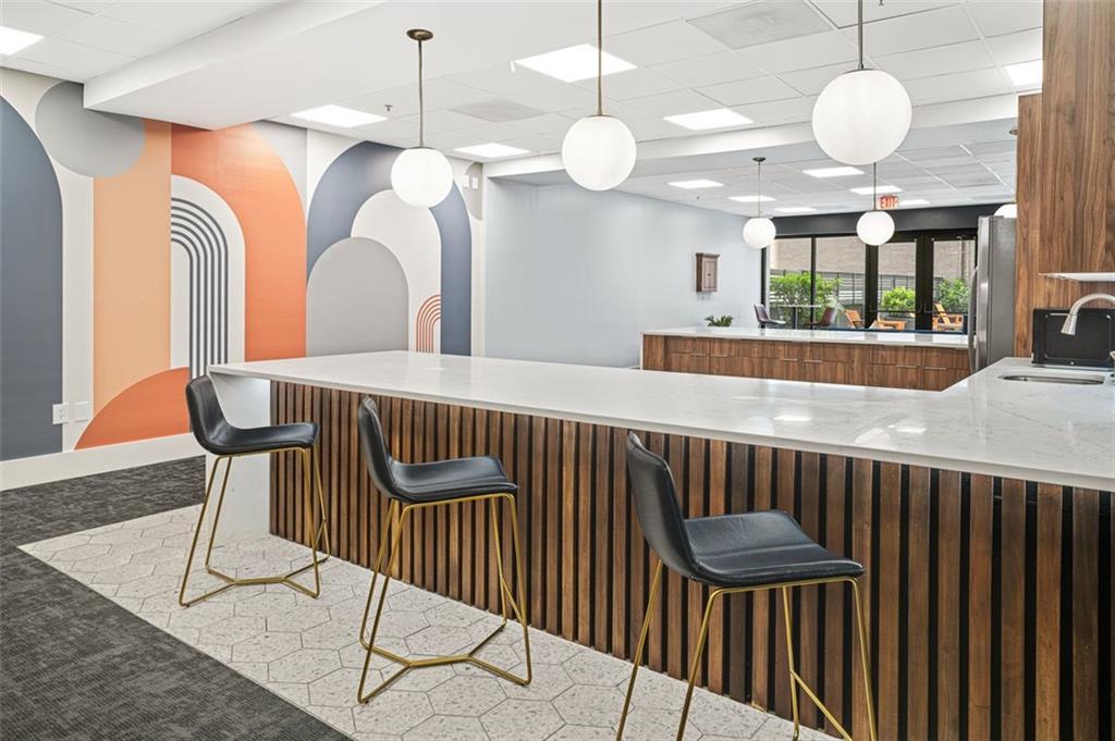 620 Peachtree Street Northeast, Unit 1716 Atlanta, GA 30308 - Photo 23 of 37 a view of a dining room with furniture and a chandelier