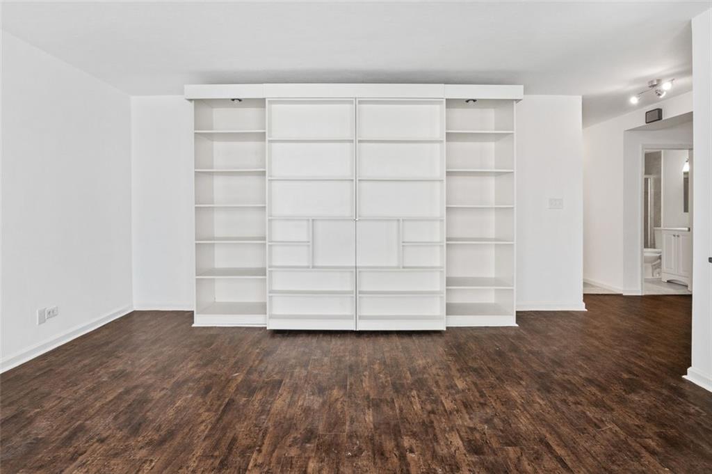 620 Peachtree Street Northeast, Unit 1716 Atlanta, GA 30308 - Photo 9 of 37 a view of a room with wooden floor and a window