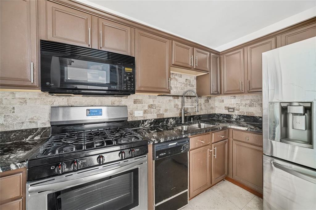 620 Peachtree Street Northeast, Unit 1716 Atlanta, GA 30308 - Photo 10 of 37 a kitchen with cabinets stainless steel appliances and a sink