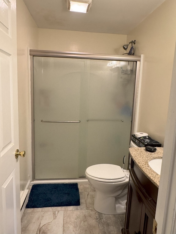 390 Great Road, Unit B19 Acton, MA 01720 - Photo 7 of 10 a bathroom with a toilet and a shower