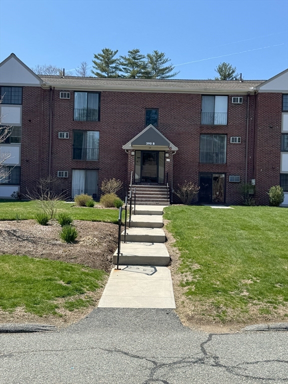 390 Great Road, Unit B19 Acton, MA 01720 - Photo 10 of 10 a front view of a house with a yard