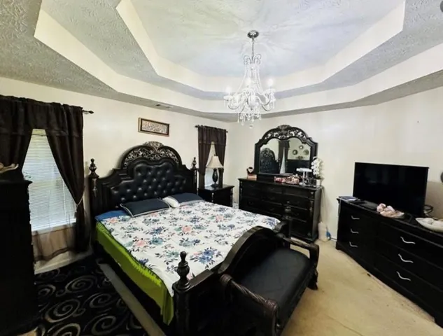 a white bath tub sitting in a bathroom next to a window