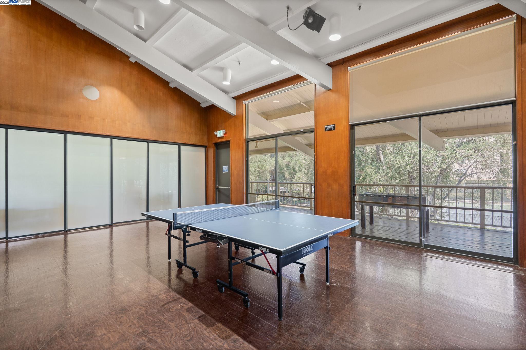300 North Civic Drive, Unit 403 Walnut Creek, CA 94596 - Photo 17 of 19 a dining hall with stainless steel appliances granite countertop a refrigerator a stove and white cabinets with wooden floor