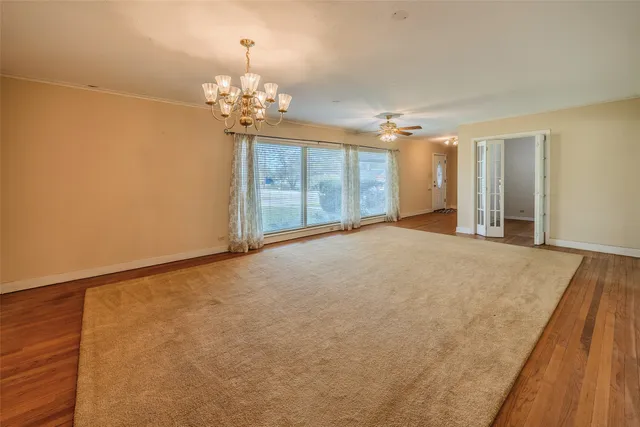 a view of a livingroom with a chandelier fan