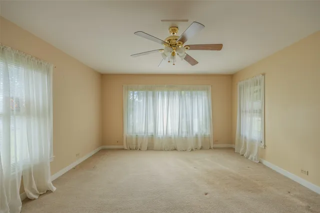 a bathroom with a shower a toilet and a sink