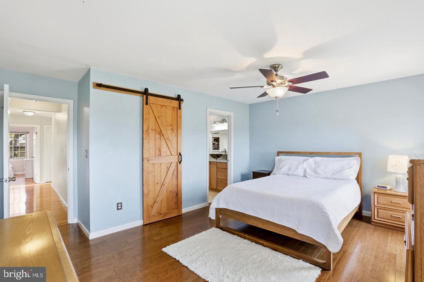 4708 Summit Road Charles Town, WV 25414 - Photo 16 of 33 Serene bedroom with rustic charm.