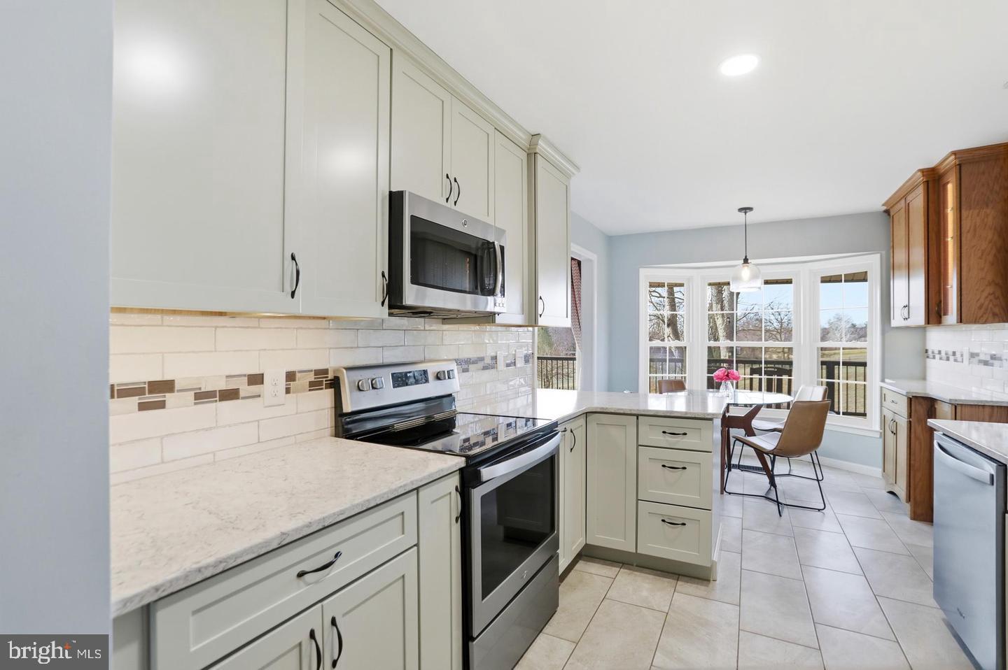 4708 Summit Road Charles Town, WV 25414 - Photo 9 of 33 Bright and airy modern kitchen space.