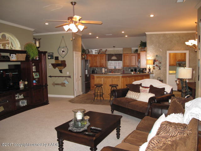 6606 Rally Road Amarillo, TX 79119 - Photo 7 of 20 a living room with furniture kitchen view and a chandelier