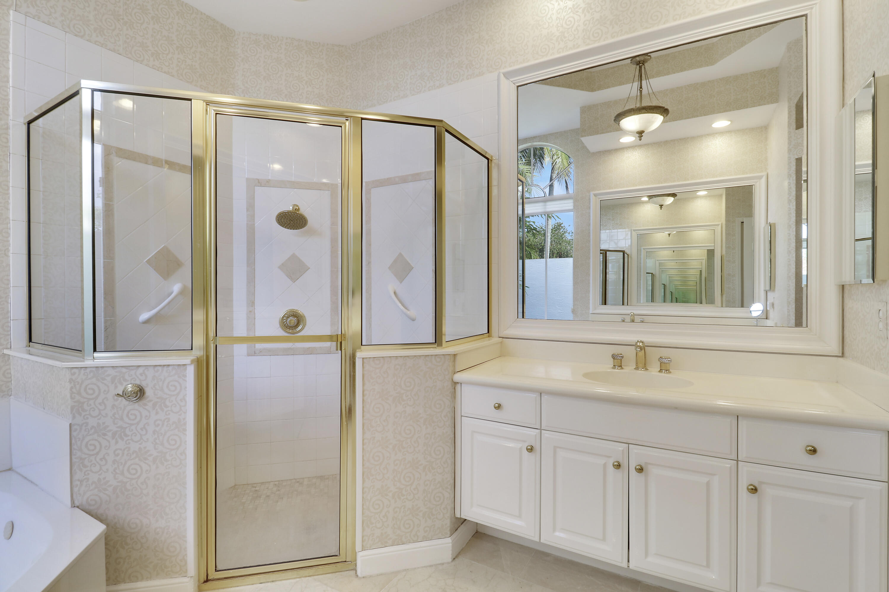8216 Cypress Point Road West Palm Beach, FL 33412 - Photo 12 of 62 a bathroom with a shower sink and mirror