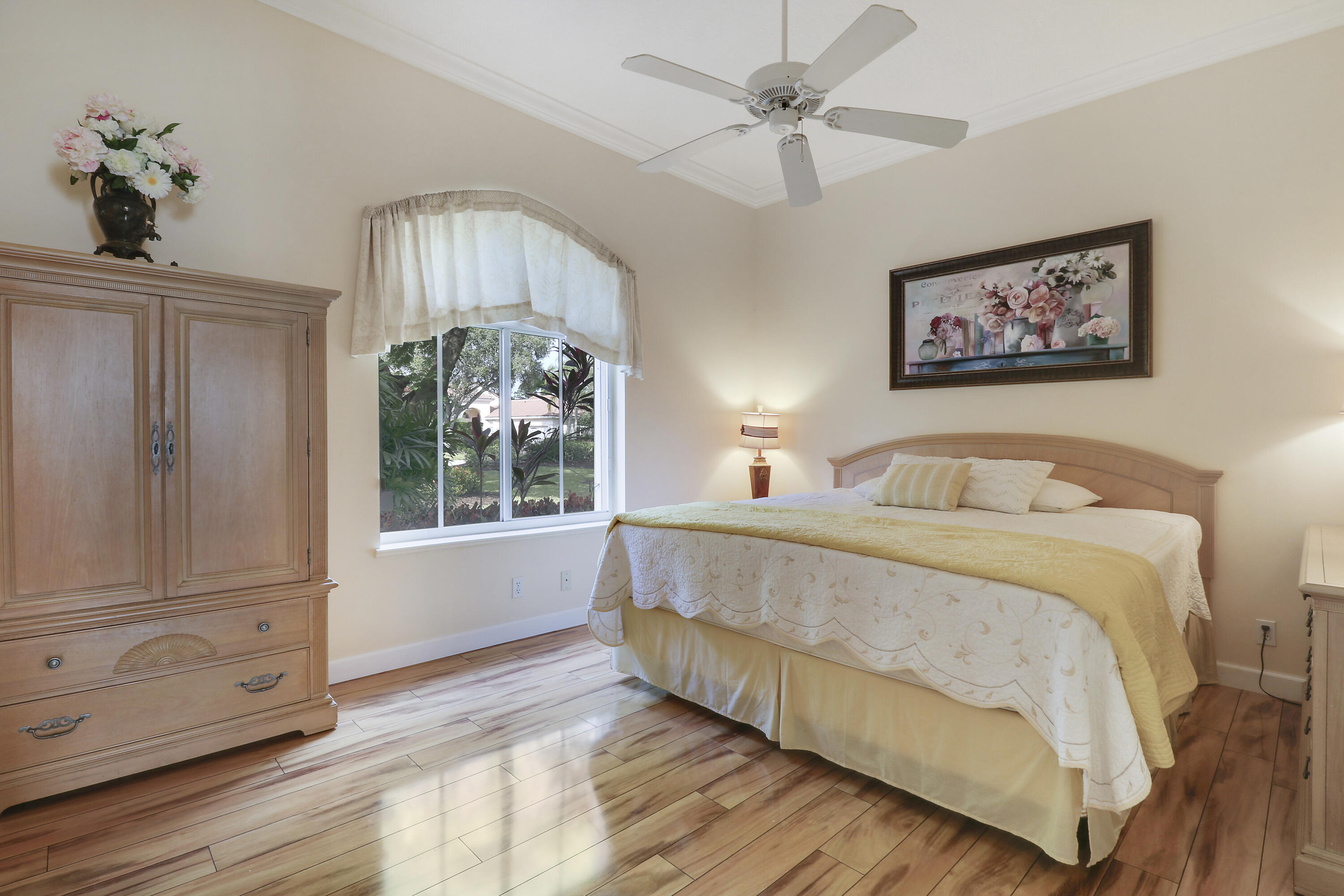 8216 Cypress Point Road West Palm Beach, FL 33412 - Photo 14 of 62 a bedroom with a large bed and a window