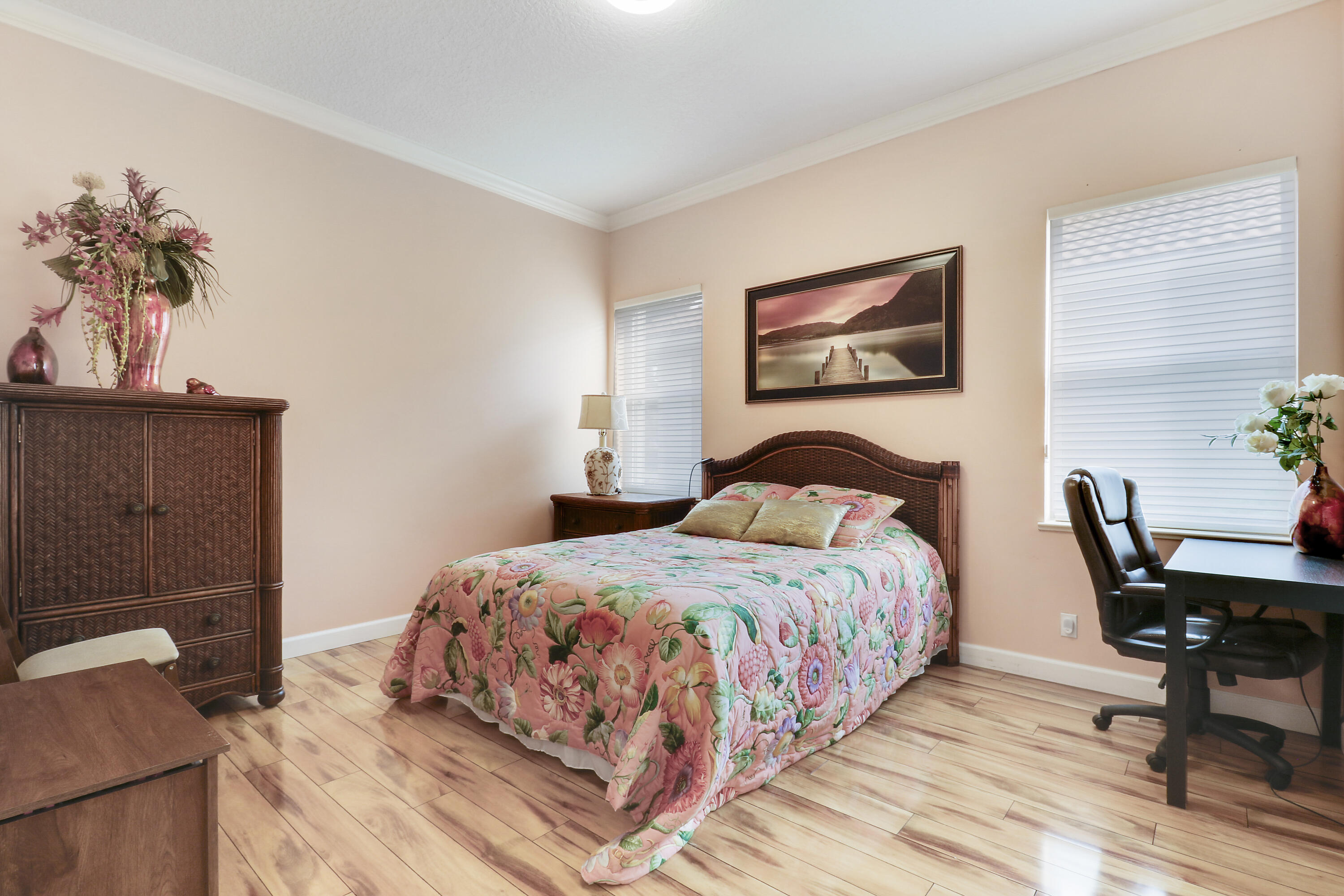 8216 Cypress Point Road West Palm Beach, FL 33412 - Photo 15 of 62 a bedroom with a bed and a potted plant