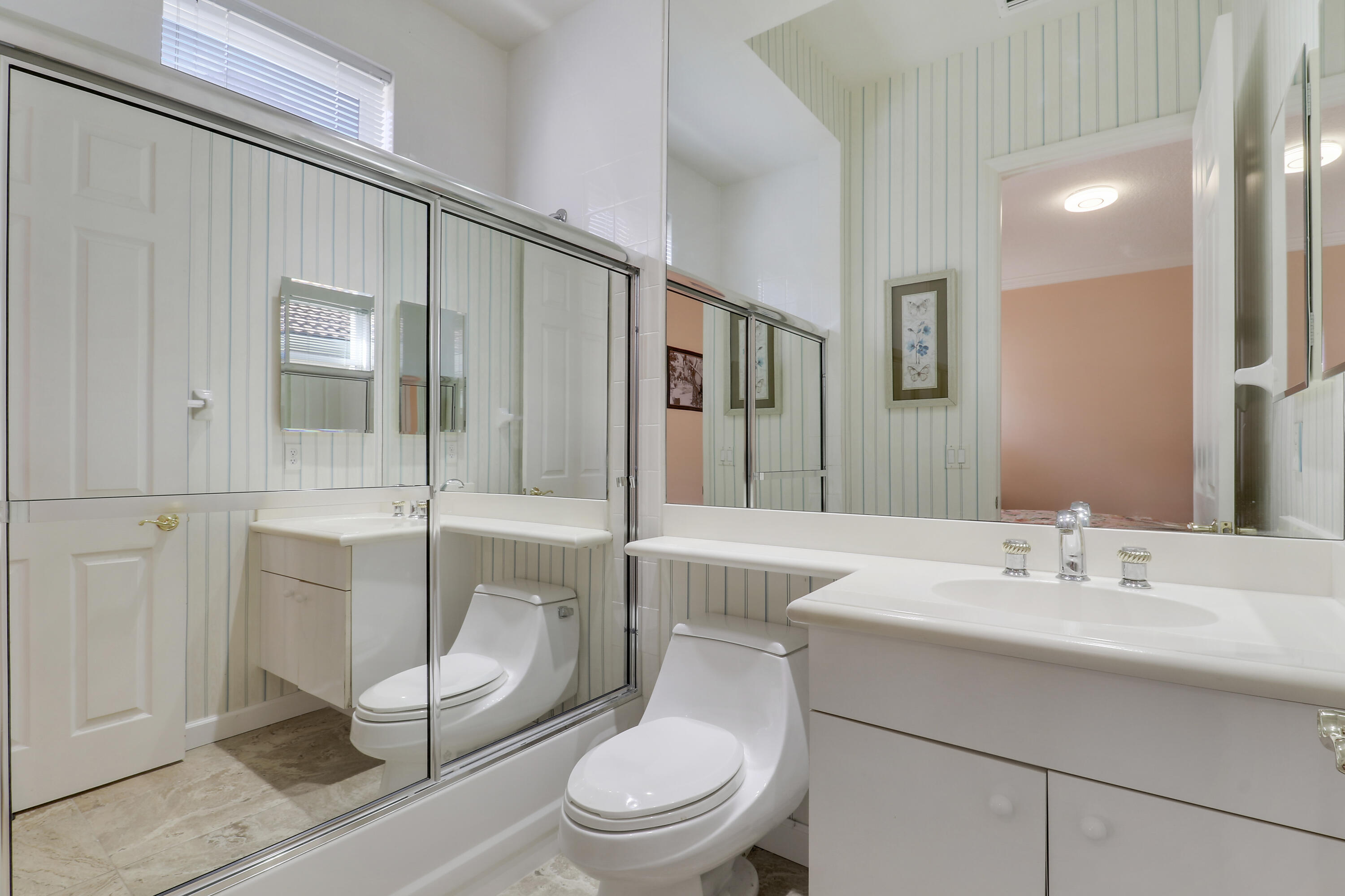 8216 Cypress Point Road West Palm Beach, FL 33412 - Photo 17 of 62 a bathroom with a sink a toilet and shower