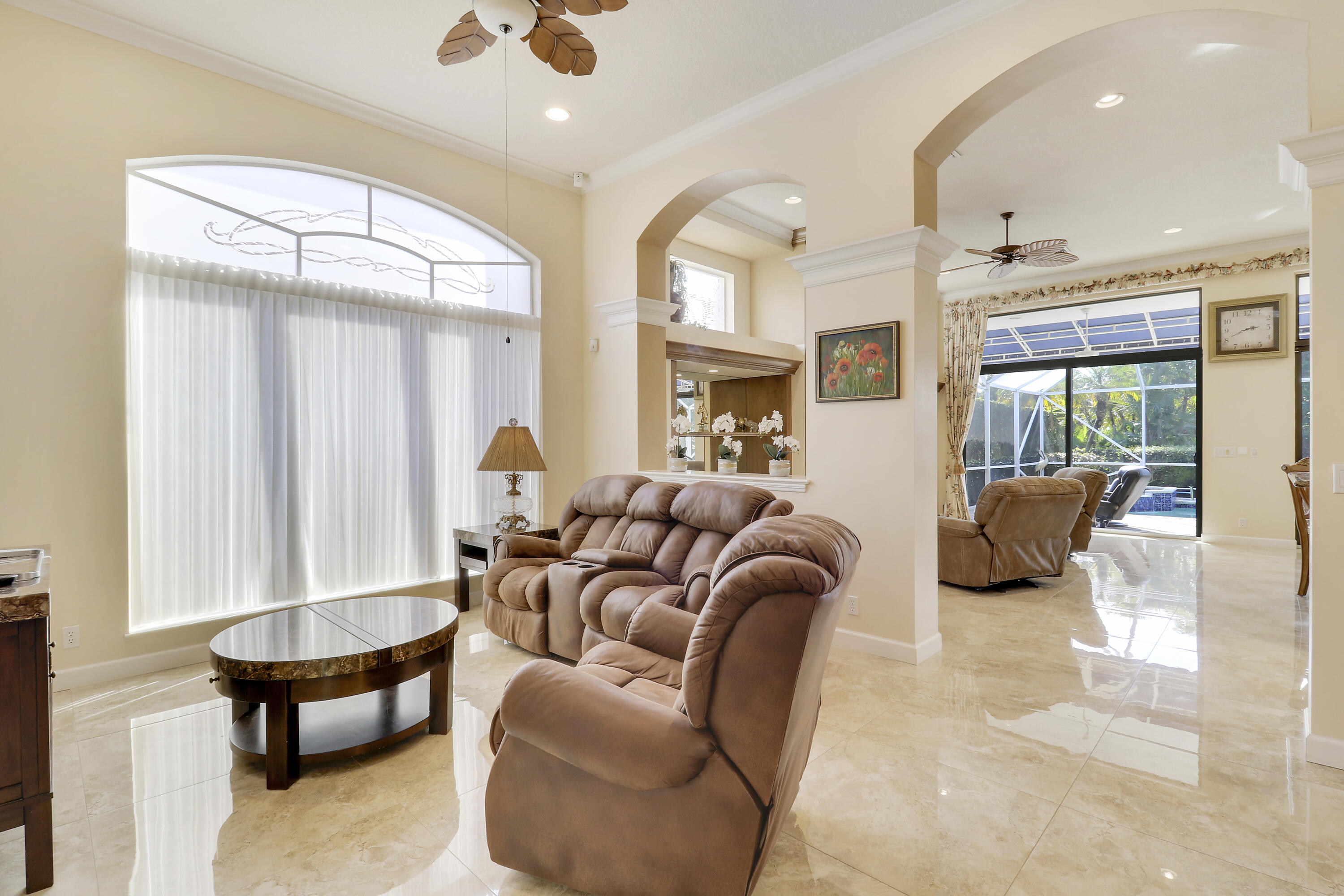 8216 Cypress Point Road West Palm Beach, FL 33412 - Photo 20 of 62 a living room with furniture ceiling fan and a rug