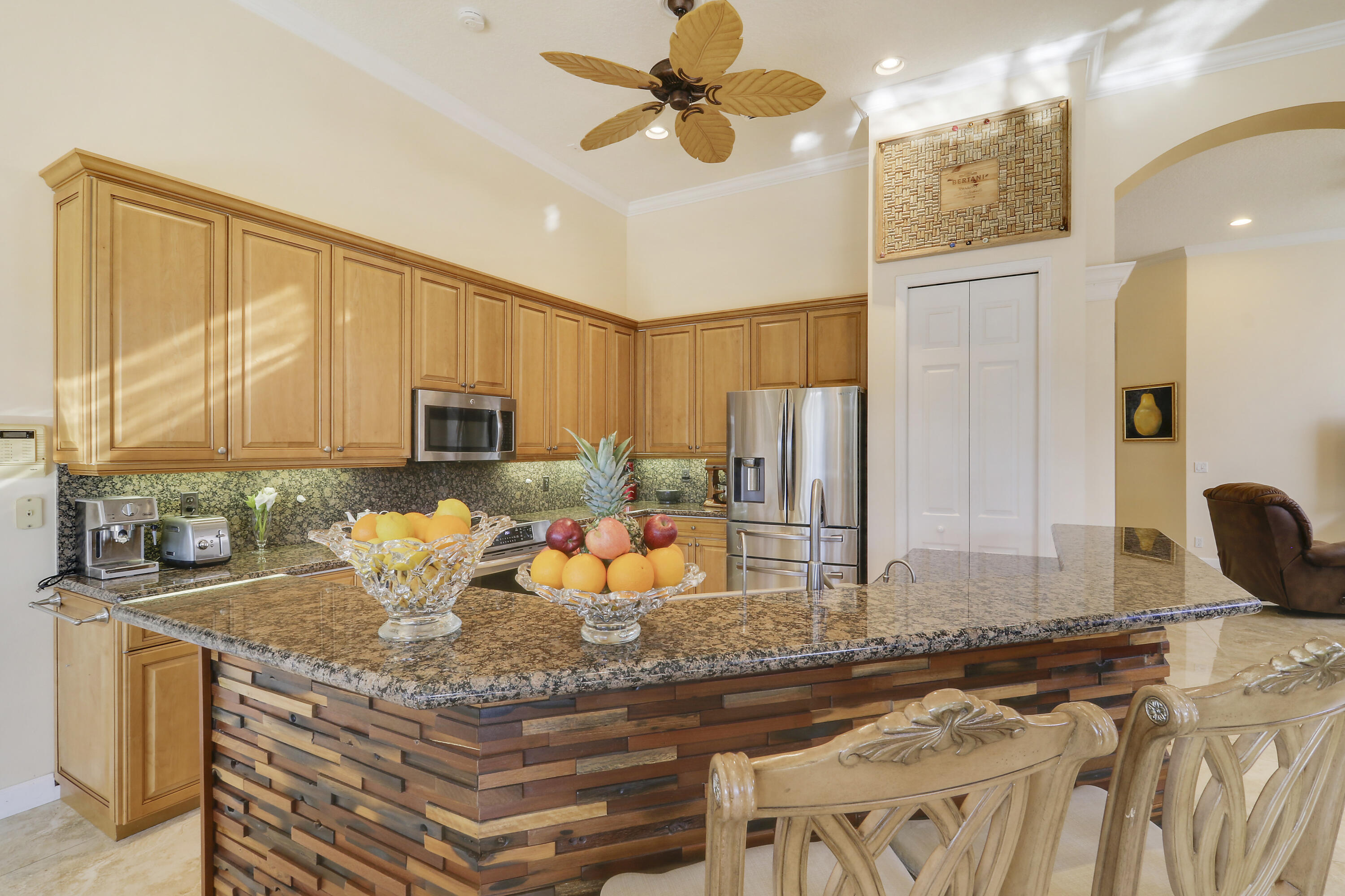 8216 Cypress Point Road West Palm Beach, FL 33412 - Photo 28 of 62 a kitchen with stainless steel appliances granite countertop a stove refrigerator and cabinets