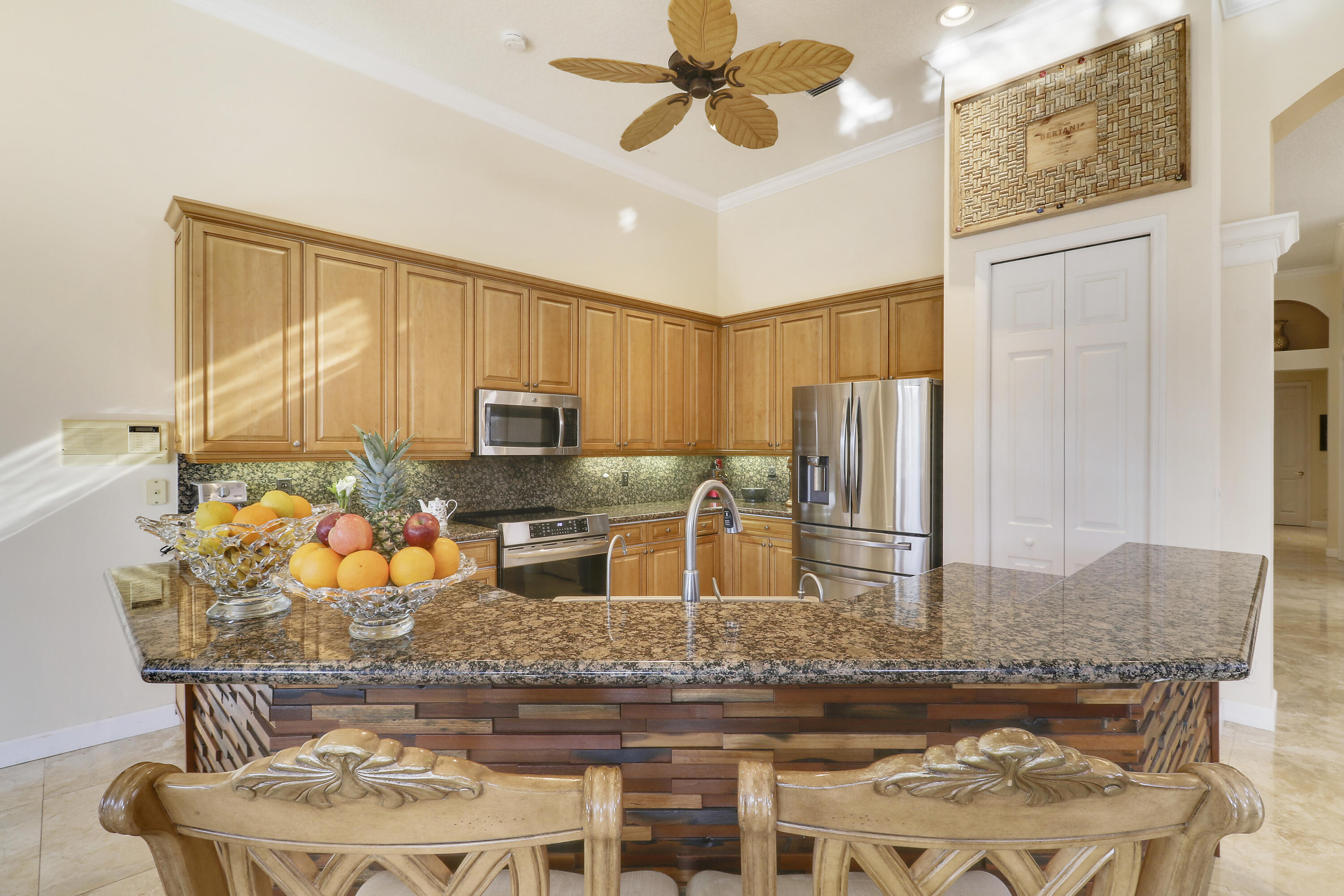 8216 Cypress Point Road West Palm Beach, FL 33412 - Photo 29 of 62 a kitchen with stainless steel appliances granite countertop a stove refrigerator and microwave