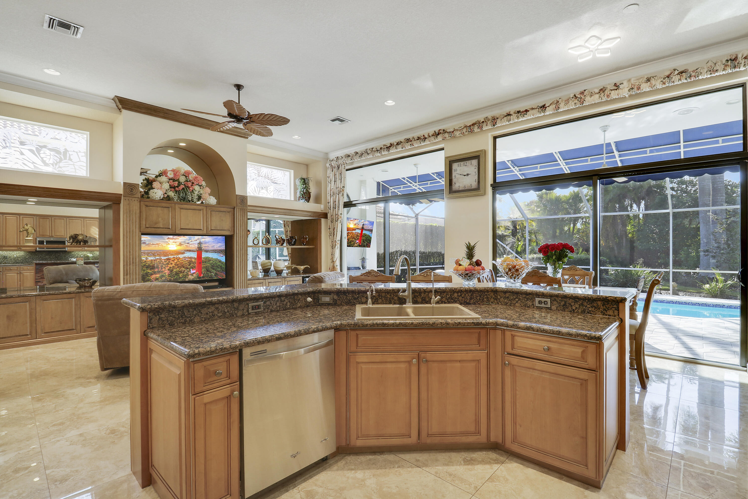 8216 Cypress Point Road West Palm Beach, FL 33412 - Photo 31 of 62 a kitchen with a sink stove and cabinets