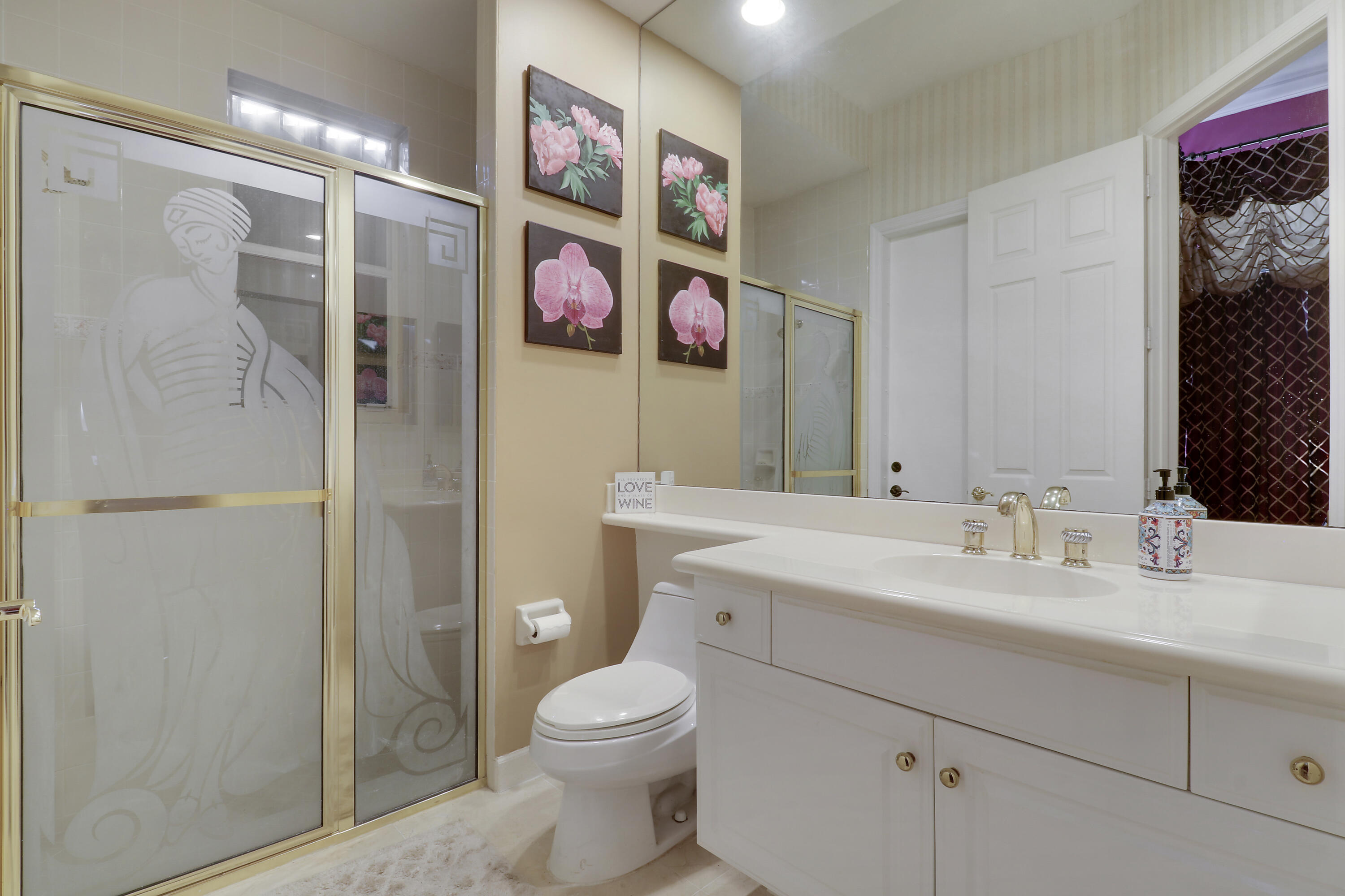 8216 Cypress Point Road West Palm Beach, FL 33412 - Photo 36 of 62 a bathroom with a sink a toilet and shower