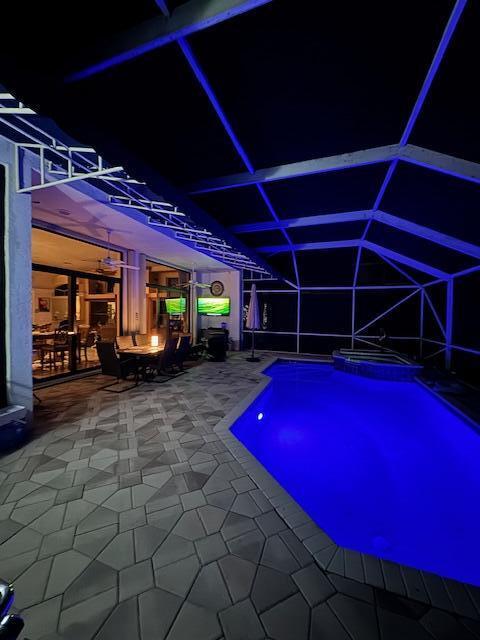 8216 Cypress Point Road West Palm Beach, FL 33412 - Photo 39 of 62 Evening with Colorful Pool Lights