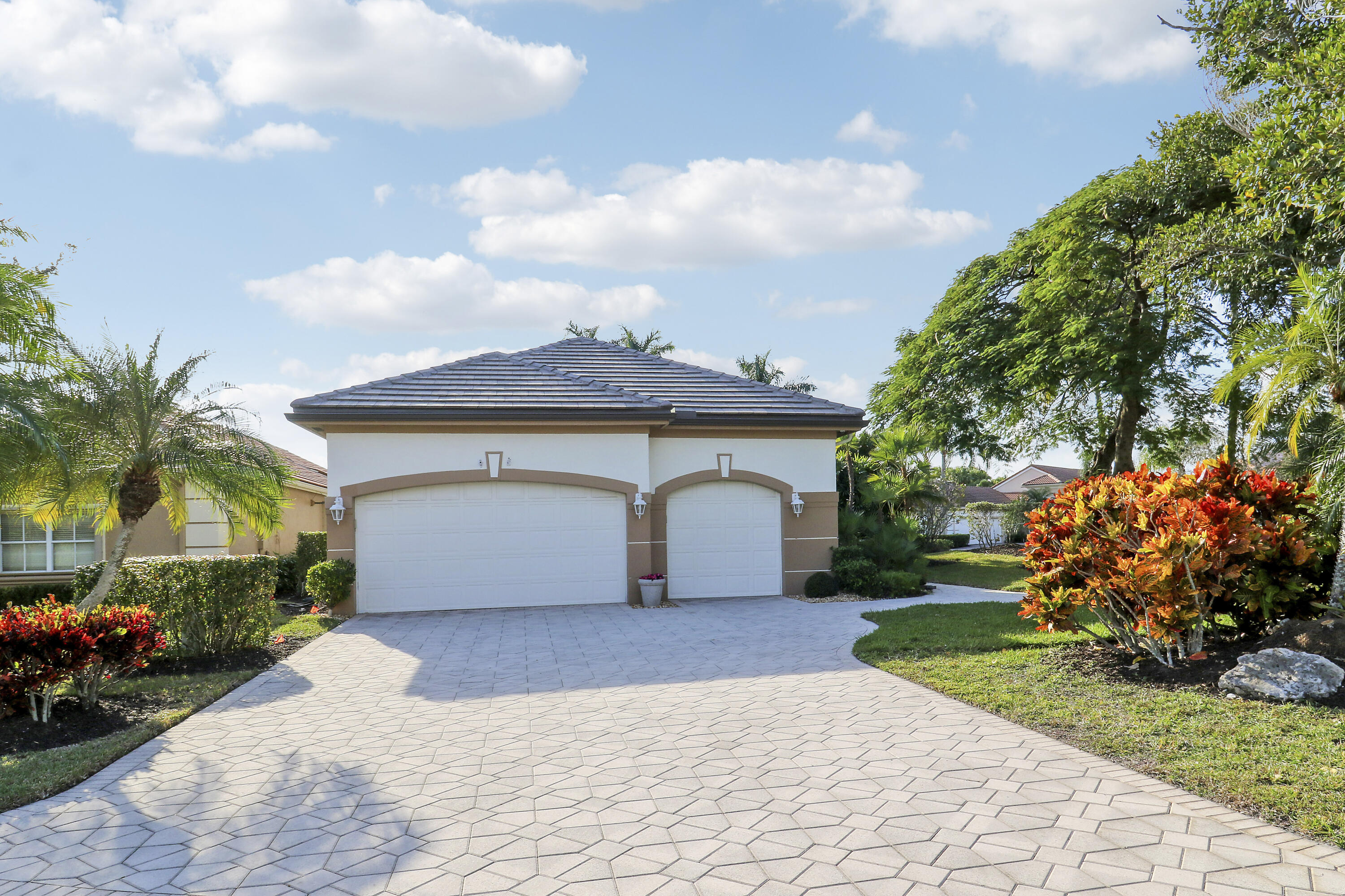 8216 Cypress Point Road West Palm Beach, FL 33412 - Photo 40 of 62 a view of a house with a yard and potted plants