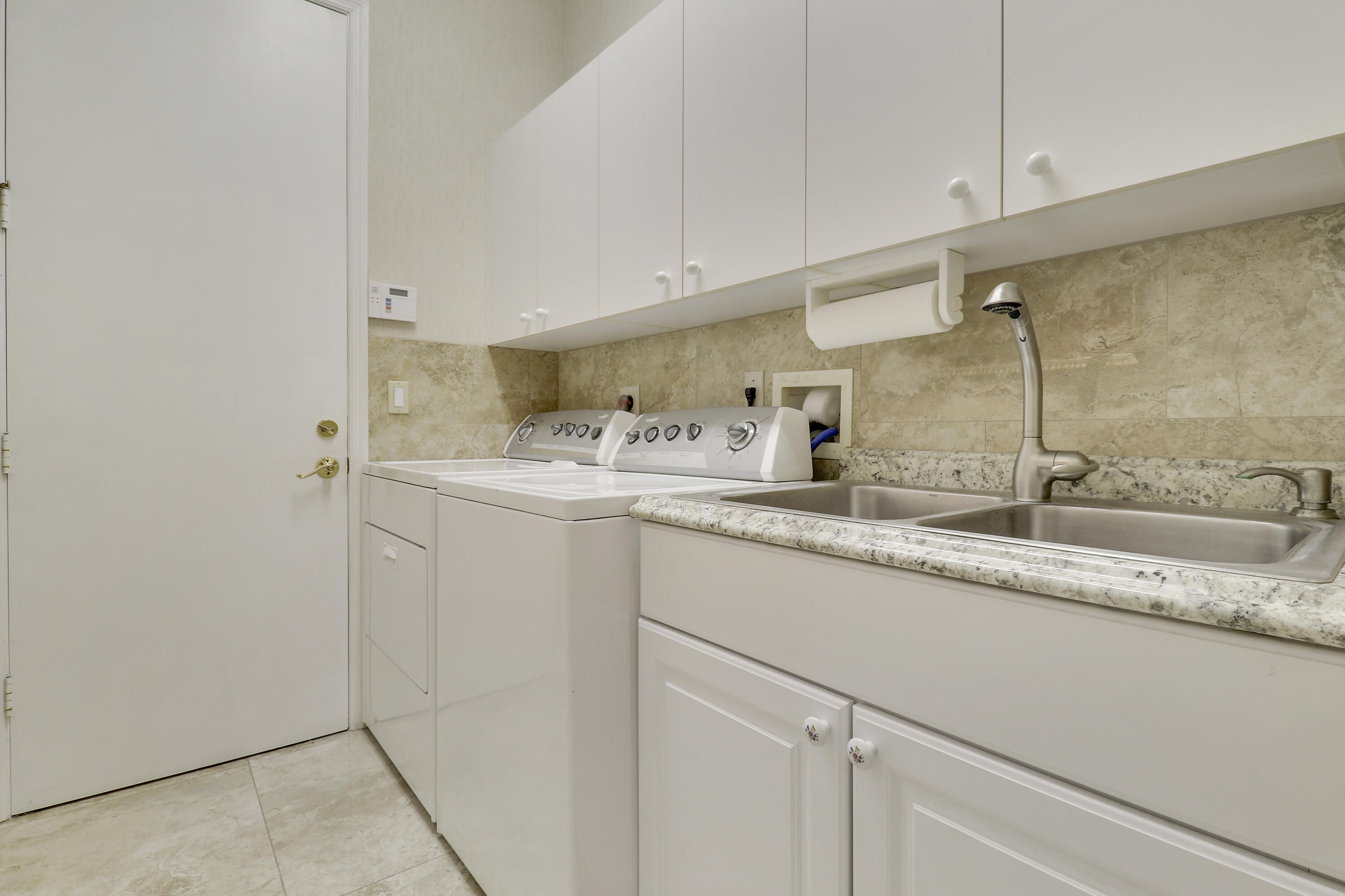 8216 Cypress Point Road West Palm Beach, FL 33412 - Photo 44 of 62 a bathroom with a sink and a mirror