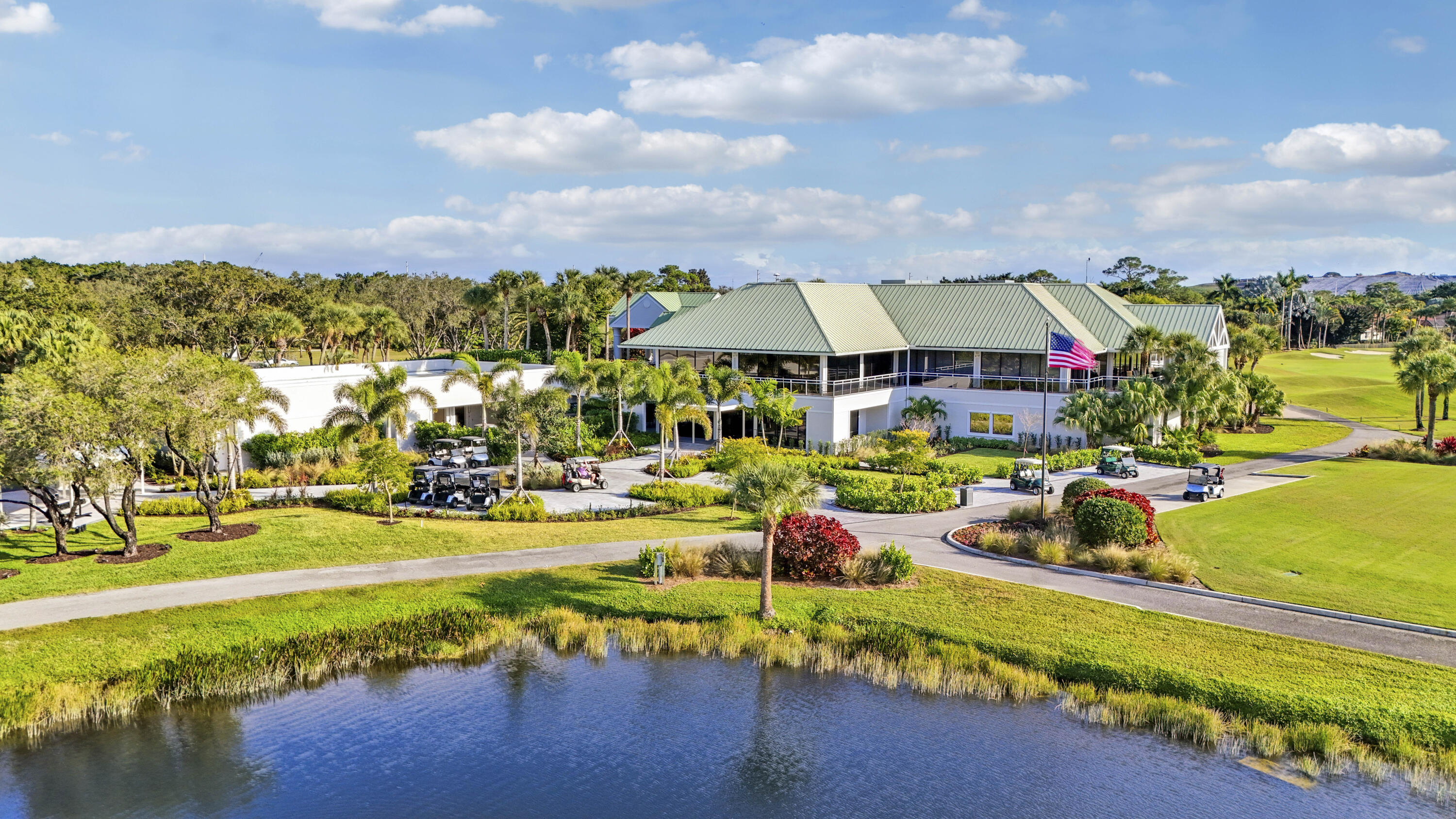 8216 Cypress Point Road West Palm Beach, FL 33412 - Photo 50 of 62 a view of a swimming pool and lounge chair