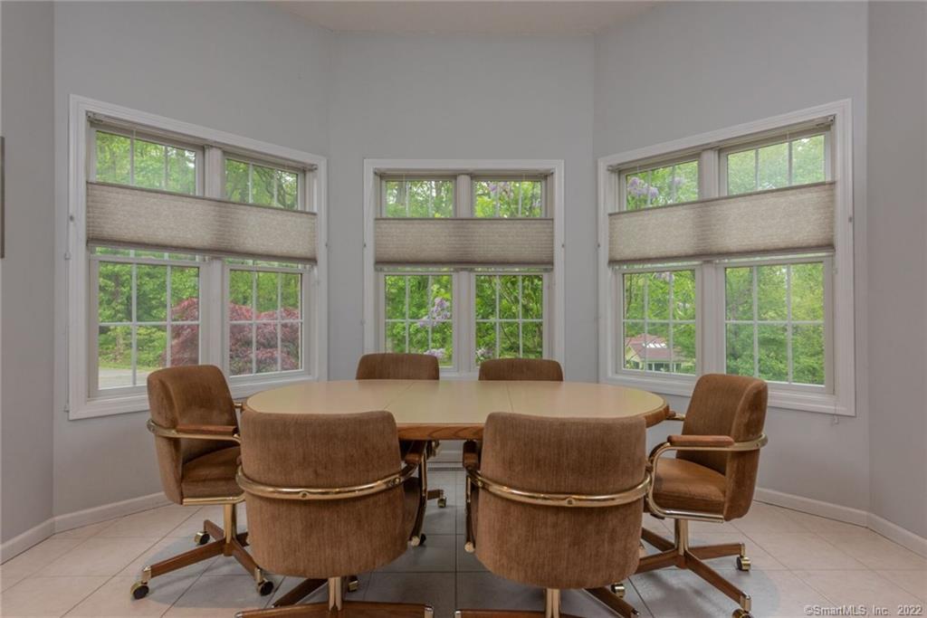 54 Bulkeley Hill Road Colchester, CT 06415 - Photo 12 of 40 a view of a dining room with furniture window and outside view