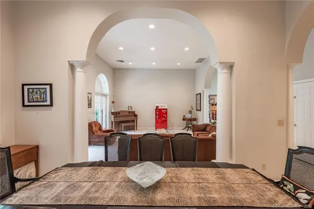 a view of a a dining room with furniture window and outside view