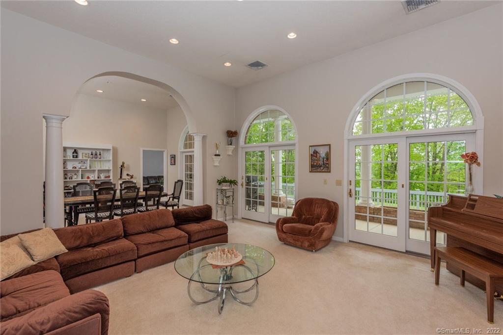 54 Bulkeley Hill Road Colchester, CT 06415 - Photo 19 of 40 a living room with furniture and a large window