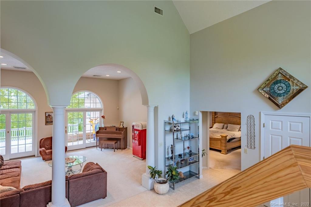 54 Bulkeley Hill Road Colchester, CT 06415 - Photo 22 of 40 a living room with furniture and a large window