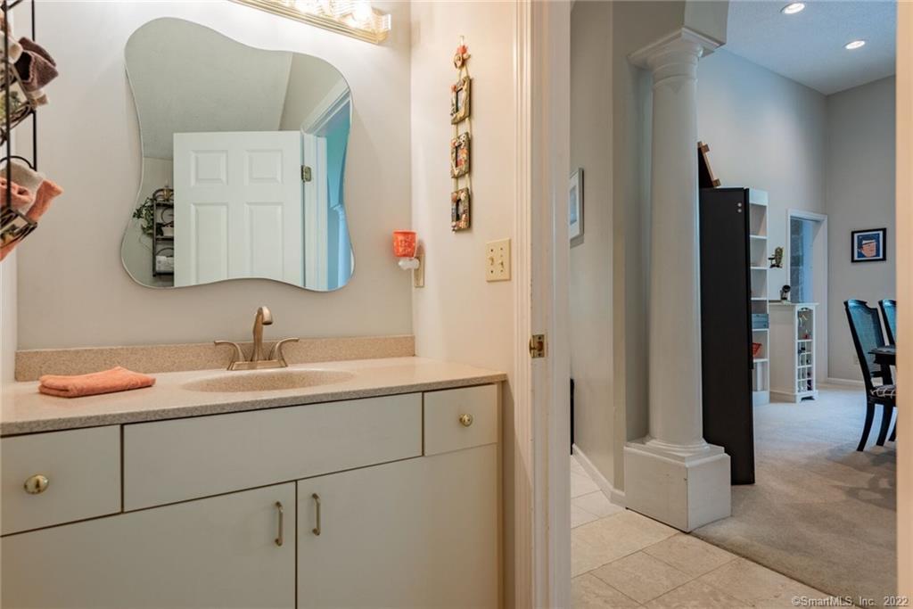 54 Bulkeley Hill Road Colchester, CT 06415 - Photo 25 of 40 a bathroom with a sink and a mirror