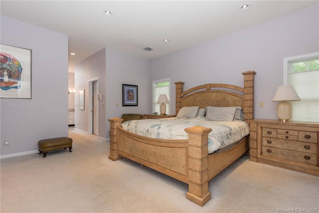 54 Bulkeley Hill Road Colchester, CT 06415 - Photo 26 of 40 a bedroom with a bed and a lamp on dresser