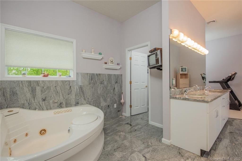 54 Bulkeley Hill Road Colchester, CT 06415 - Photo 29 of 40 a bathroom with a tub a sink and a shower