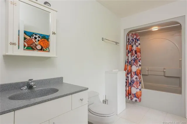 a bedroom with a bed and a closet