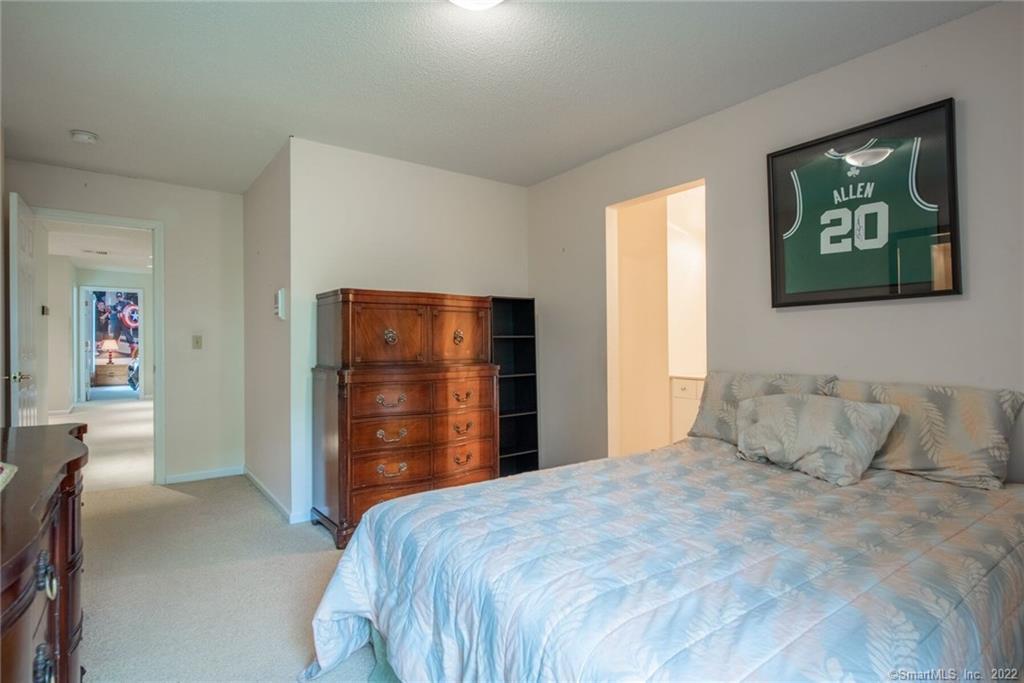 54 Bulkeley Hill Road Colchester, CT 06415 - Photo 34 of 40 a bedroom with a bed and a closet