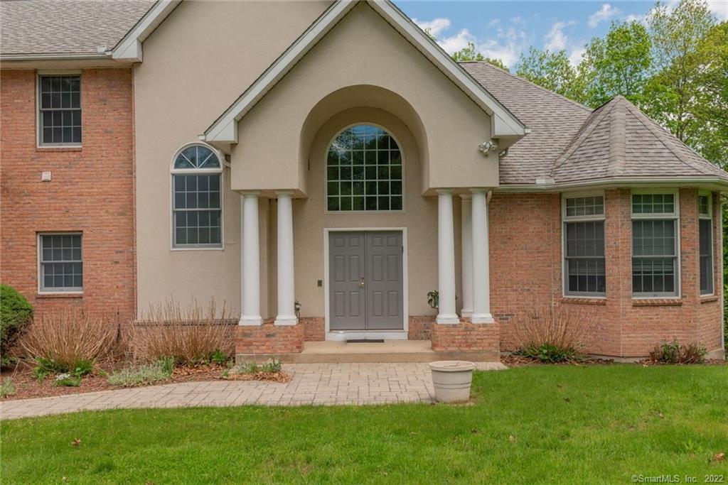54 Bulkeley Hill Road Colchester, CT 06415 - Photo 35 of 40 a front view of a house with garden