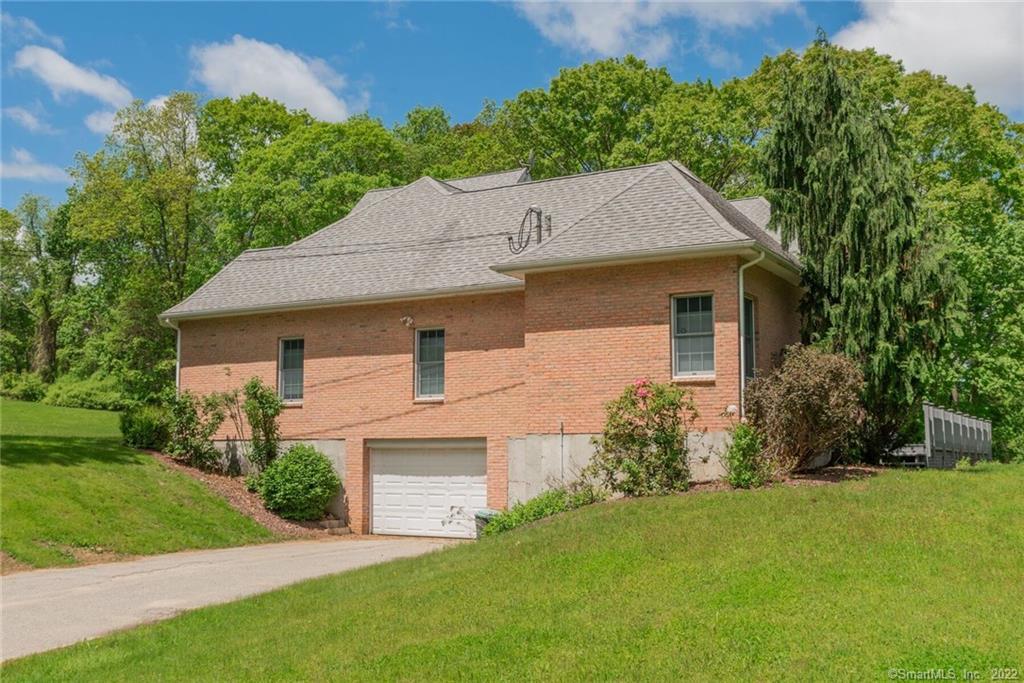 54 Bulkeley Hill Road Colchester, CT 06415 - Photo 6 of 40 a front view of a house with a garden