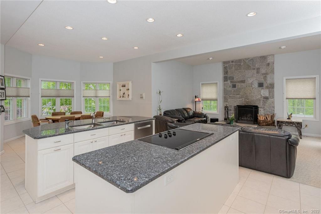 54 Bulkeley Hill Road Colchester, CT 06415 - Photo 10 of 40 a kitchen with stainless steel appliances granite countertop a sink stove and cabinets