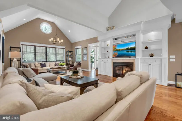 a spacious bathroom with a granite countertop sink and a mirror
