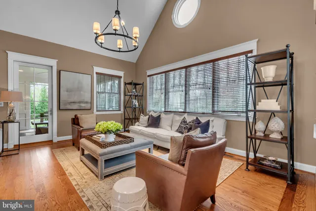 a kitchen with stainless steel appliances granite countertop a sink dishwasher and a stove with wooden floor