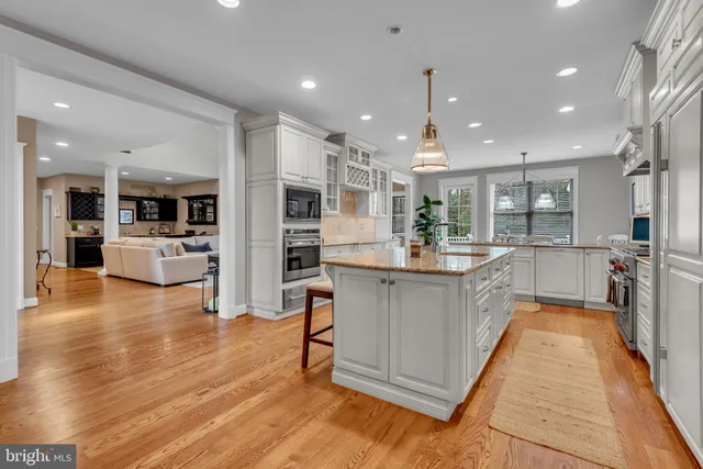 a view of a workspace with furniture and a bookshelf