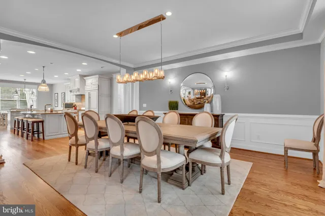a spacious bathroom with a double vanity sink mirror and bathtub