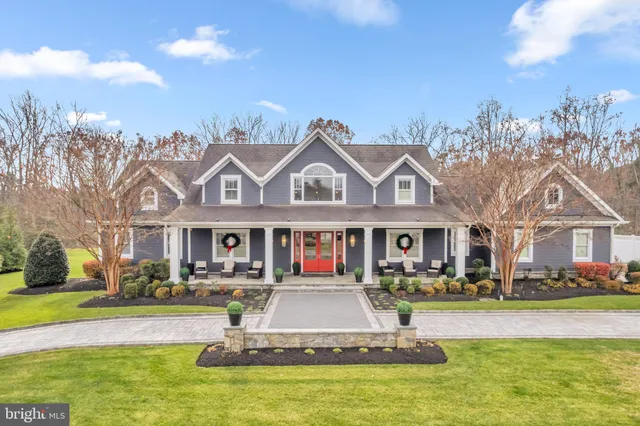 a front view of houses with yard swimming pool and outdoor seating